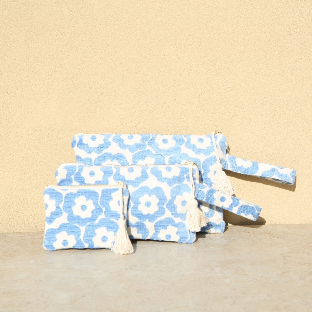Marabu flower clutch in light blue — cheerful floral print on natural cotton canvas, three sizes, made in Greece