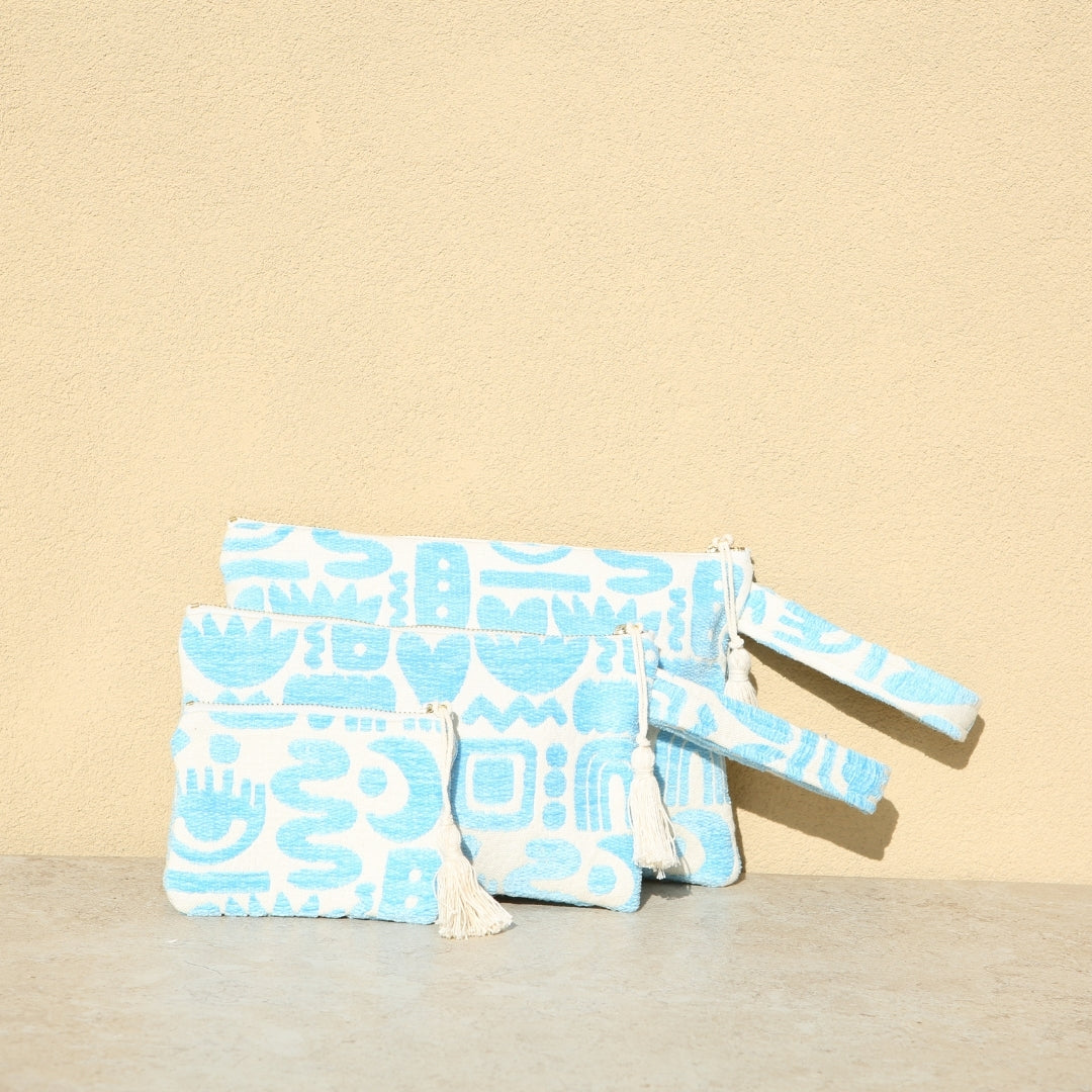Marabu symbols clutch in turquoise — abstract symbols print on natural cotton canvas, three sizes, made in Greece