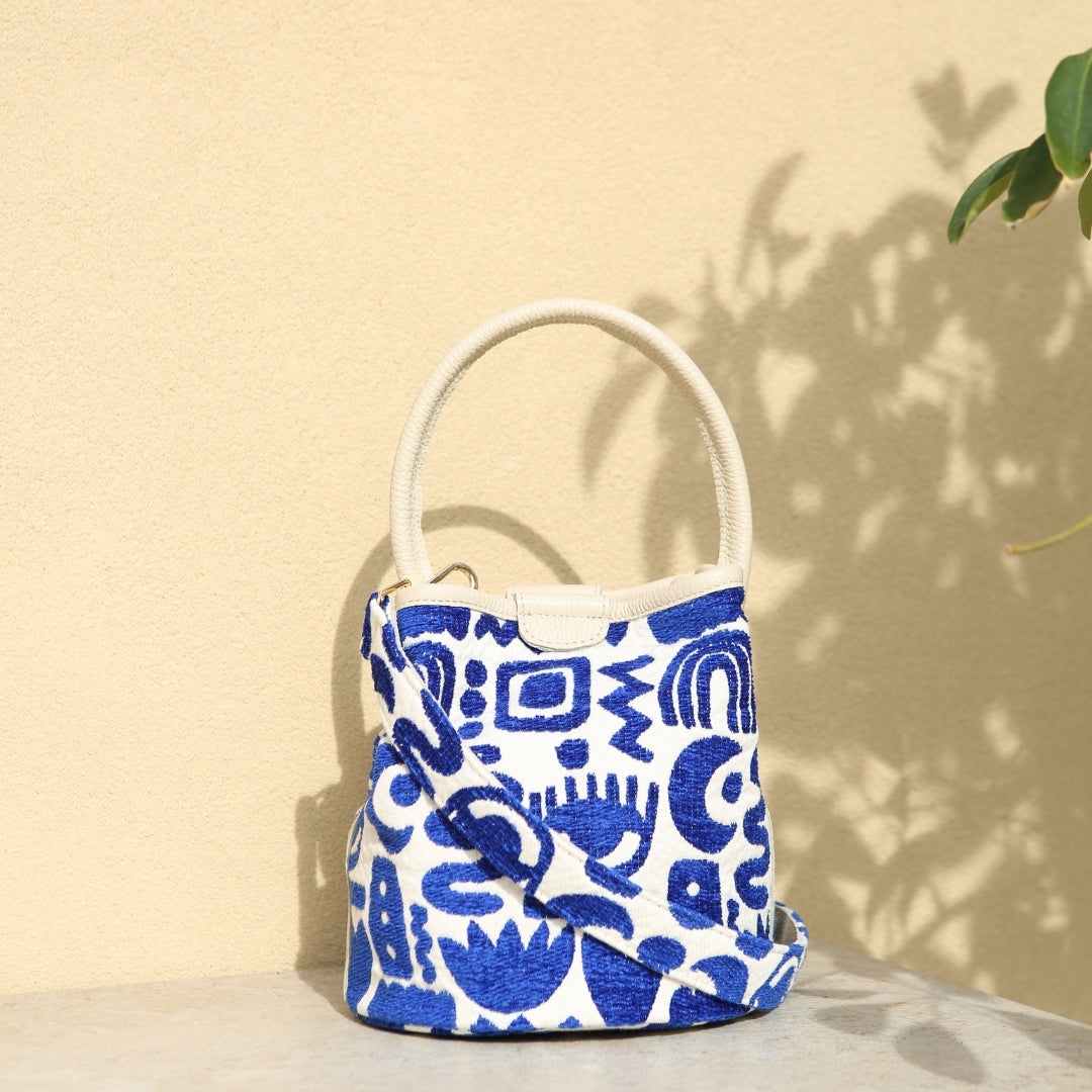 Marabu bucket bag in deep blue Symbols print — bold Greek-inspired embroidery on natural cotton canvas, made in Greece