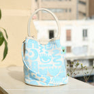 Marabu bucket bag in turquoise Symbols print — natural cotton, rope handle, compact summer bag, handmade in Greece