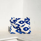 Marabu flap bag in deep blue Fish Eye print — structured cotton with adjustable strap and gold hardware, made in Greece