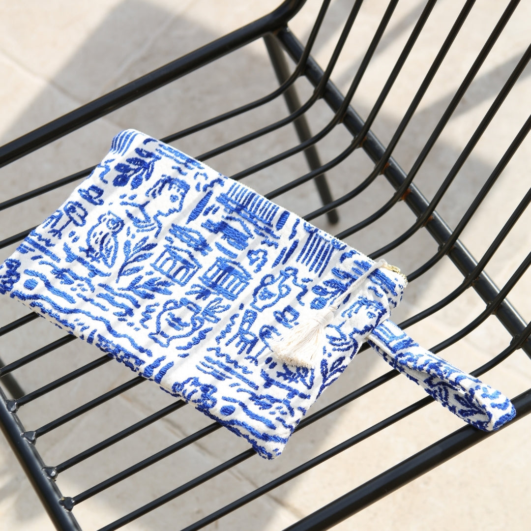Marabu Greece clutch — blue ancient Greek print cotton clutch with tassel, lifestyle shot, made in Greece