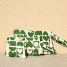 Marabu heart clutch in green — bold heart print on natural cotton, tassel zip, handmade in Greece