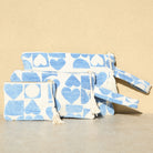 Marabu heart clutch in light blue — heart and geometric print on natural cotton canvas, three sizes, made in Greece