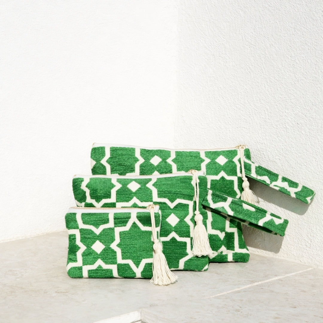 Marabu star clutch in green — bold geometric star print on natural cotton, tassel zip, three sizes, handmade in Greece