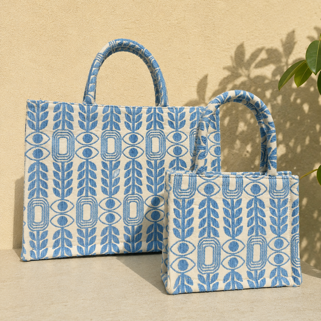 Marabu Unity Square Tote Bag — small and large sizes in light blue Greek evil eye print, handcrafted natural cotton, as seen on Emily in Paris cast in Mykonos