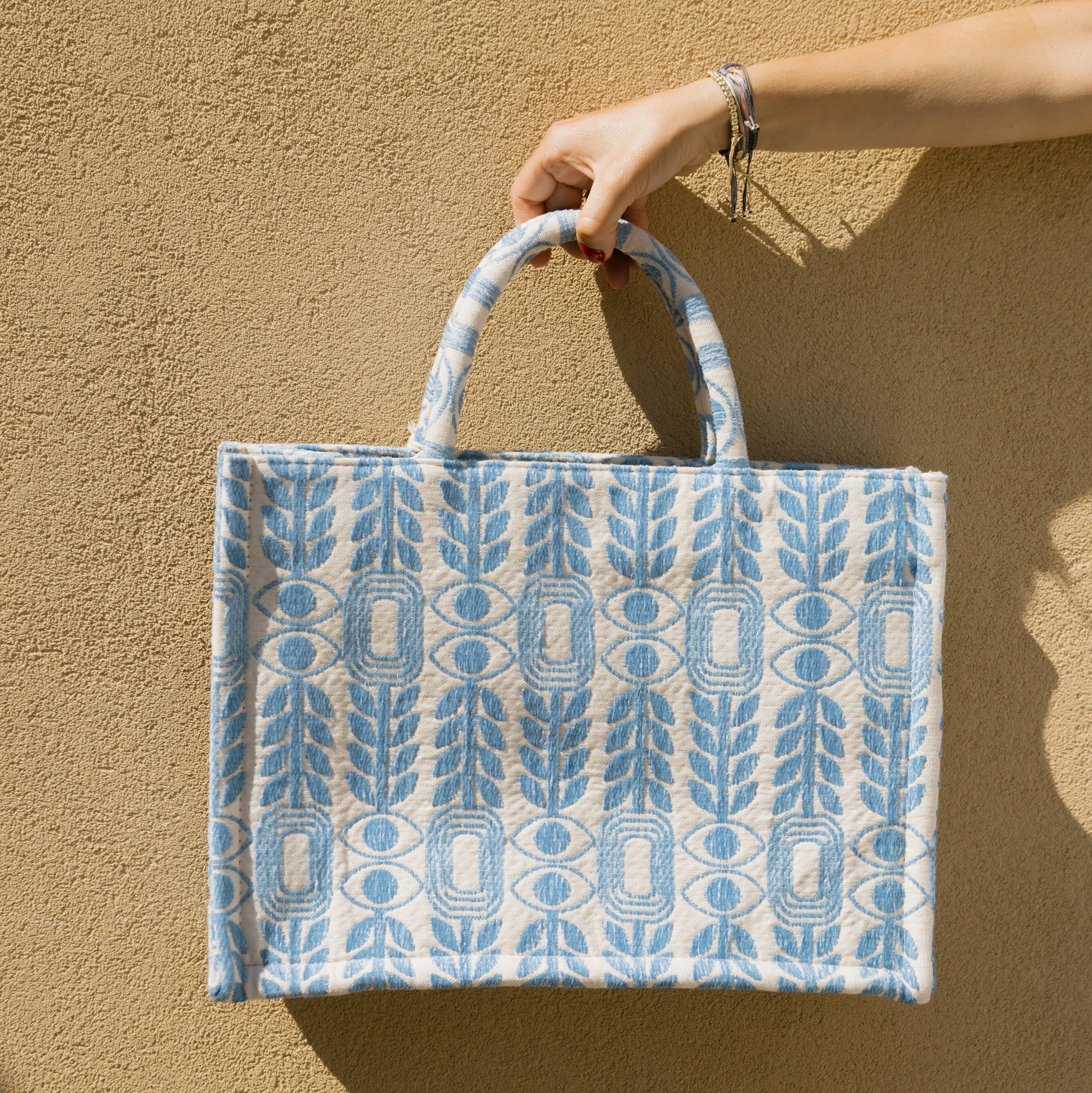Marabu Unity Square Tote Bag — light blue evil eye and olive branch embroidery on natural cotton canvas, handmade in Greece